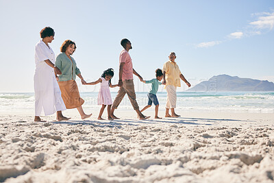 Buy stock photo Holding hands, vacation and family on beach, walking and break to relax, happiness and ocean water waves. Grandparents, father and mother with grandkids, seaside holiday and quality time together