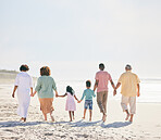 Family at beach, holding hands and generations outdoor, people walk on sand with grandparents, parents and kids. Together, support and trust, travel to Bali with love, care and bond with back view 