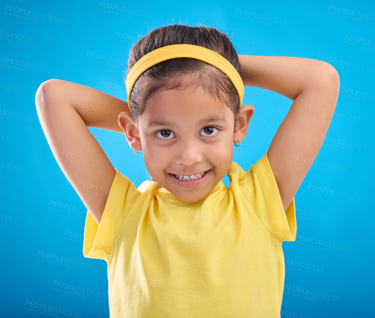 Buy stock photo Young girl, portrait and studio with a student feeling happy with a smile and blue background. Isolated, cute and adorable child face in a yellow outfit with happiness, joy and cheerful smiling