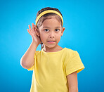 Hearing, eavesdrop and portrait of a children listening isolated on a blue background in a studio. Listen, attention and young girl holding an ear for sound, gossip and a secret on a backdrop