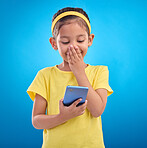 Phone, smile and child laugh on blue background for social media, funny video and internet meme in studio. Technology, communication mockup and happy girl with humor, joke and online on smartphone