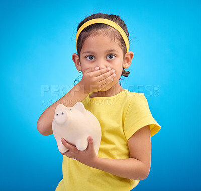Buy stock photo Piggy bank, shocked or surprised child in portrait isolated on blue background savings mistake or investment risk. Wow face of girl kid and saving jar or container for finance or money fear in studio