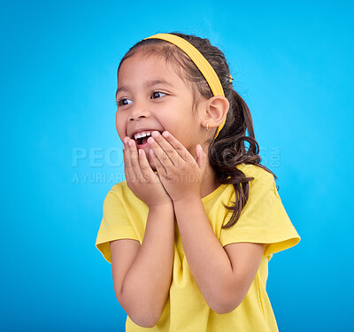 Buy stock photo Laughing, happy and child looking curious while isolated on a blue background in a studio. Smile, cheerful and an adorable little girl with a laugh, happiness and innocent delight on a backdrop