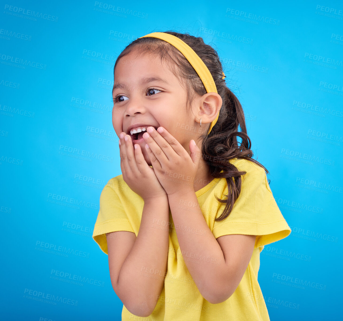 Buy stock photo Laughing, happy and child looking curious while isolated on a blue background in a studio. Smile, cheerful and an adorable little girl with a laugh, happiness and innocent delight on a backdrop