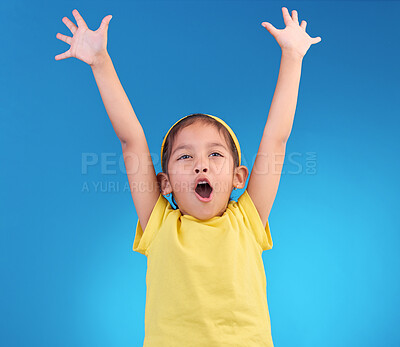 Buy stock photo Child, goal cheer and studio with a little girl feeling happy with energy and celebration. Isolated blue background and young kid with arms in the air cheering crazy and yelling with happiness