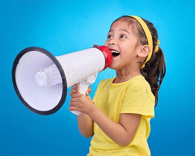 Buy stock photo Communication, speech and child with megaphone for news, opinion and announcement on blue background. Talking, speaking mockup and young girl with microphone for voice, scream and attention in studio