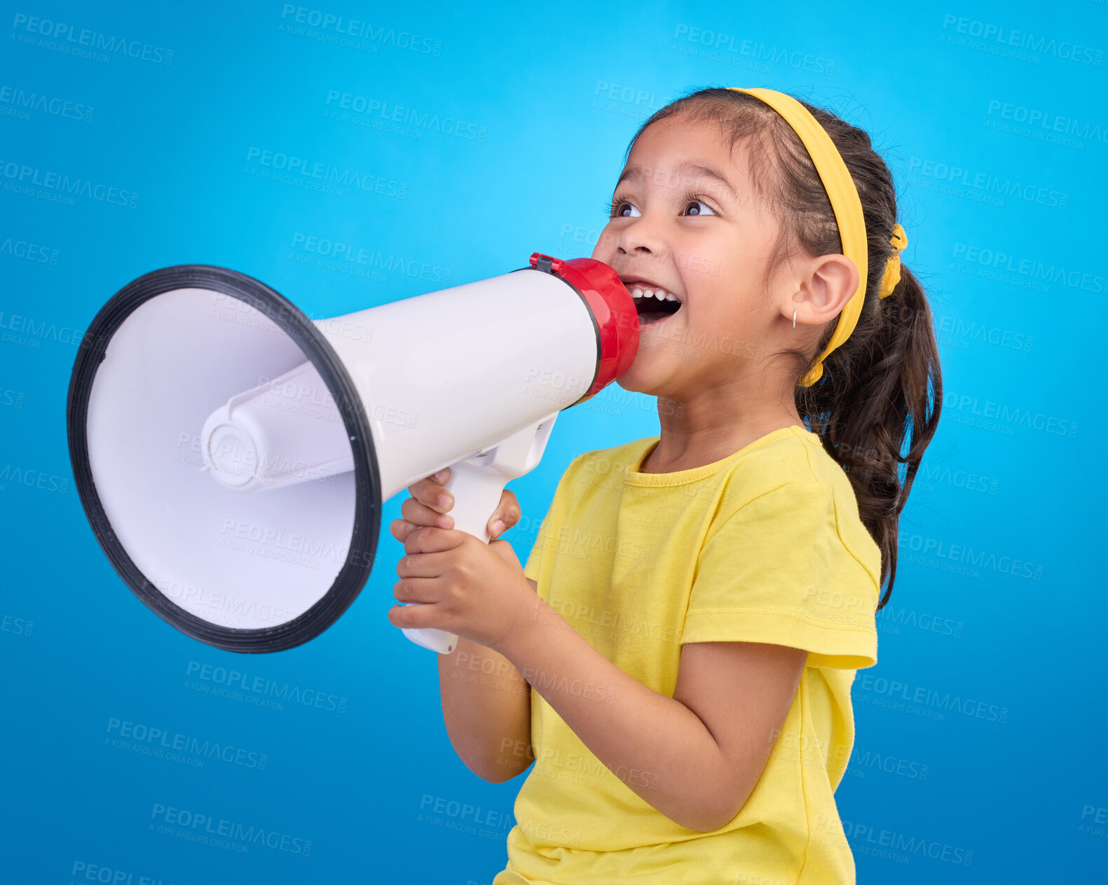 Buy stock photo Communication, speech and child with megaphone for news, opinion and announcement on blue background. Talking, speaking mockup and young girl with microphone for voice, scream and attention in studio