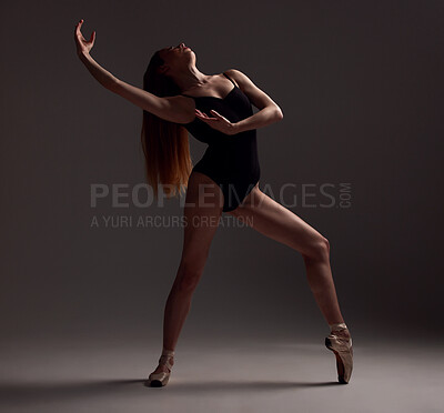Photo & Art Print Young beautiful ballerina posing in studio