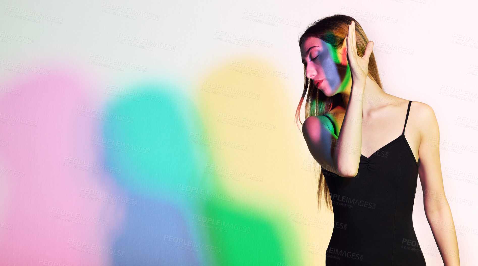 Buy stock photo Light, beauty and fashion with woman in studio for creative, aesthetic or neon glow. Kaleidoscope, cosmetics and disco with model and cmyk color shadows for designer, art or party on white background