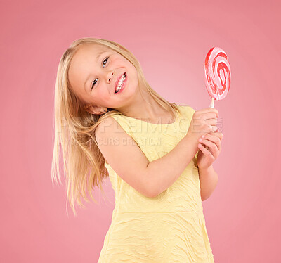 Buy stock photo Candy, happy and lollipop with portrait of girl in studio for sugar, party and carnival food isolated on pink background. Cute, positive and youth with child and eating snack for playful and treats  
