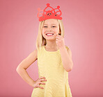 Girl, child and smile portrait with a crown in studio on a pink background with smile and prop. Female princess kid model with happiness, creativity and royal icon in hand isolated on color and space