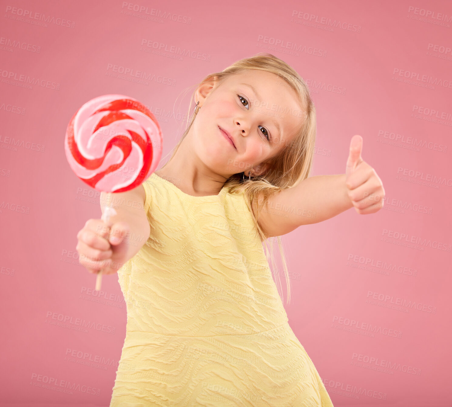 Buy stock photo Candy, thumbs up and lollipop with portrait of girl in studio for sugar, party and carnival food isolated on pink background. Cute, positive and youth with child or eating snack for playful and treat