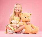 Teddy bears, girl and portrait with soft toys with happiness and love for playing in a studio. Isolated, pink background and a young female child feeling happy, joy and cheerful with stuffed friend