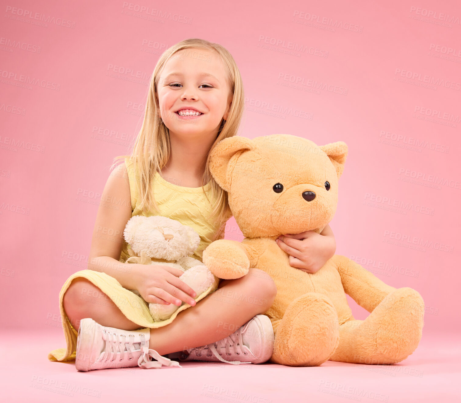 Buy stock photo Teddy bears, girl and portrait with soft toys with happiness and love for playing in a studio. Isolated, pink background and a young female child feeling happy, joy and cheerful with stuffed friend