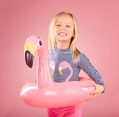 Buy stock photo Safety, happy and portrait of girl and pool float for swimming, summer break and relax. Youth, funny and inflatable with child and flamingo ring for pool, smile and beach holiday on pink background