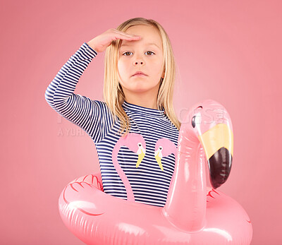 Buy stock photo Safety, search and portrait of girl and pool float for swimming, summer break or cute. Youth, swimsuit and inflatable with child and flamingo ring for playful, beach and holiday on pink background