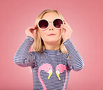 Studio, portrait of small girl in studio with sunglasses and fun clothes isolated on pink background. Summer, holiday and fashion clothing, happy child on vacation in Australia excited for travel.