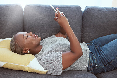 Buy stock photo Social media, happy and black woman with a phone on the sofa for communication, chat and internet. Smile, relax and African girl typing on a mobile app for connection, browsing and online search