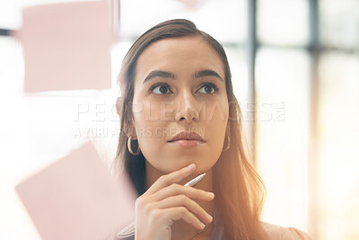 Buy stock photo Face, office brainstorming and woman thinking of notes for research, agenda and mindmap at window. Serious female employee at glass for ideas of solution, strategy and planning vision of target goals