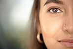 Business woman, portrait and face closeup with mock up and eye vision with blurred background. Young female, gen z person and entrepreneur with beauty and facial piercing feeling relax with mockup