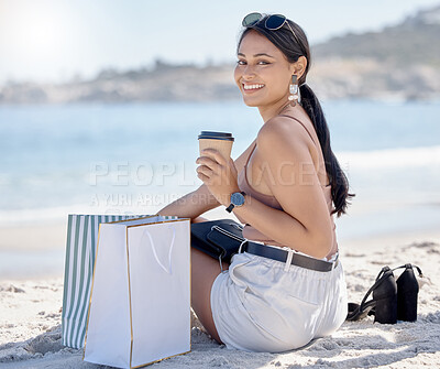 Buy stock photo Woman with shopping bag, portrait and relax on beach after retail therapy, fashion and rest with coffee. Female outdoor, latte drink and smile, happy with discount or sale with freedom and travel