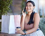 Woman with shopping bag, phone call and relax at coffee shop after retail therapy, fashion and rest. Female outdoor, latte drink and communication with chat, smile and happy with discount and sale