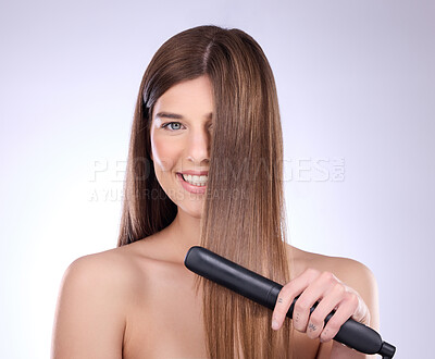 Buy stock photo Hair straightener, face portrait and beauty of woman in studio isolated on a gray background. Haircare, happy and female model with flat iron product for salon treatment, balayage and hairstyle.