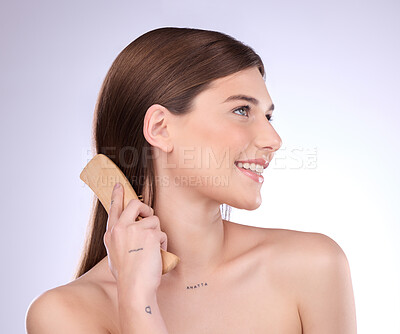 Buy stock photo Hair care, beauty smile and woman with brush in studio isolated on a gray background. Cosmetics, thinking and happy female model with sustainable wooden hairbrush for salon treatment or hairstyle.