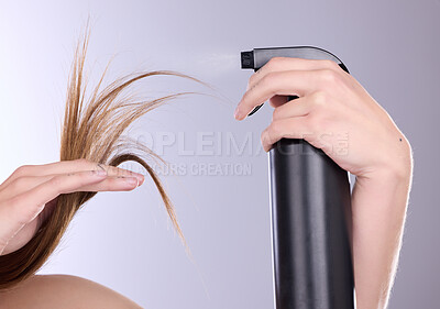 Buy stock photo Hair care, beauty and hands with spray in studio isolated on a gray background. Cosmetics product, keratin and model woman with hairspray bottle for salon treatment, growth and hairstyle moisturizer.