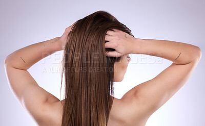 Buy stock photo Back, beauty and hair care of woman in studio isolated on a gray background. Texture, cosmetics and young female model with salon treatment for healthy keratin, balayage and natural hairstyle growth.