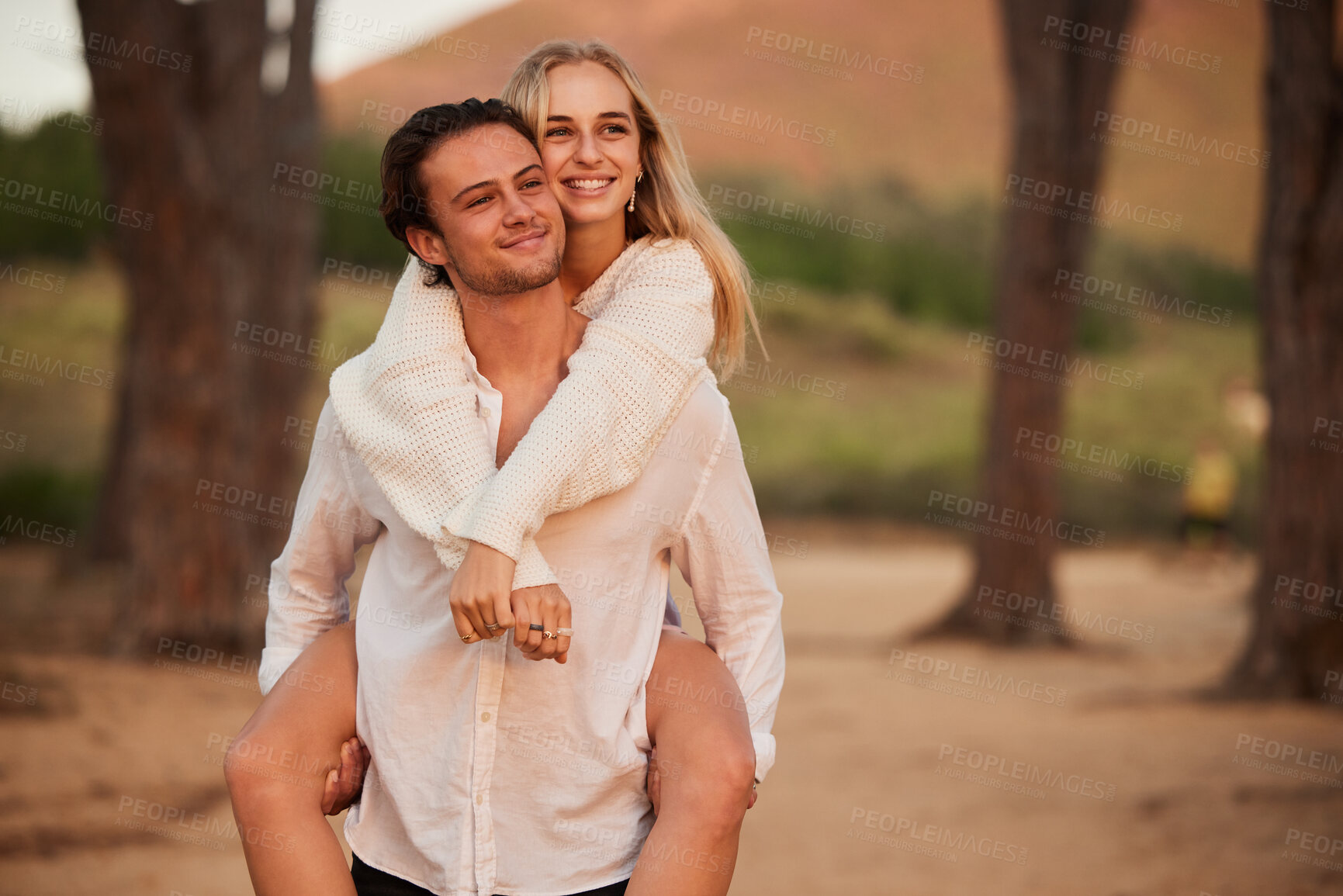 Buy stock photo Love, piggy back and couple in forest, quality time and celebrate anniversary, relationship and happiness. Romance, happy man carry woman and smile outdoor, calm and loving with joy, bonding or break