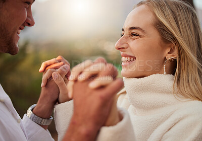 Buy stock photo Love, couple and holding hands outdoor with a smile, care and romance on date in nature. Young man and woman happy together on valentines day with trust, peace and support in forest for anniversary