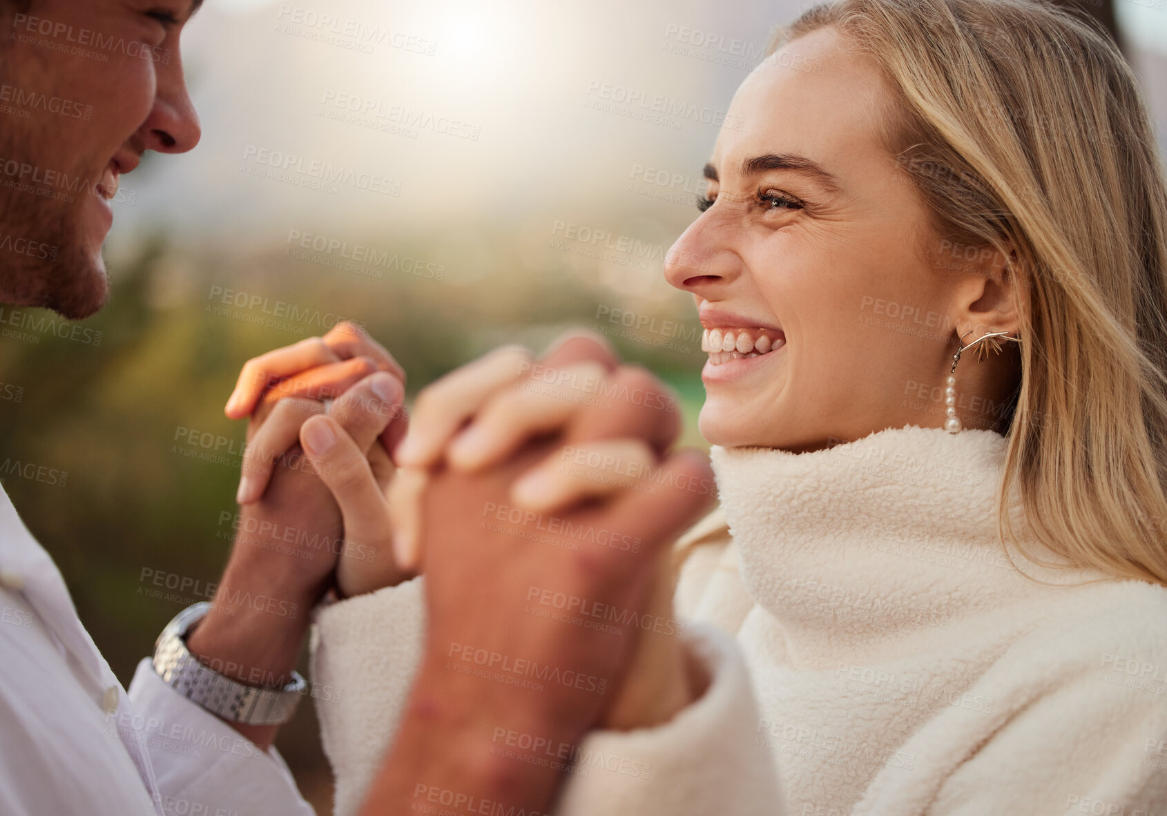 Buy stock photo Love, couple and holding hands outdoor with a smile, care and romance on date in nature. Young man and woman happy together on valentines day with trust, peace and support in forest for anniversary