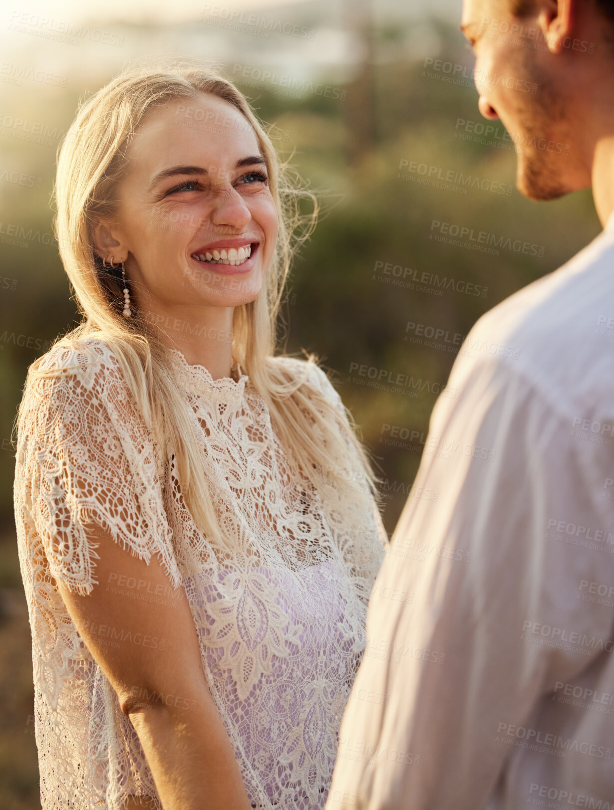 Buy stock photo Happy, smile and couple in nature at sunset for romance, bonding and quality time together outdoors. Love, dating and man and woman holding hands on holiday, honeymoon vacation and relax on weekend