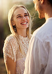 Smile, happy and couple in nature for a date, honeymoon or valentines day. Happiness, admiration and laughing man and woman together at a park for romance, conversation and fun in relationship