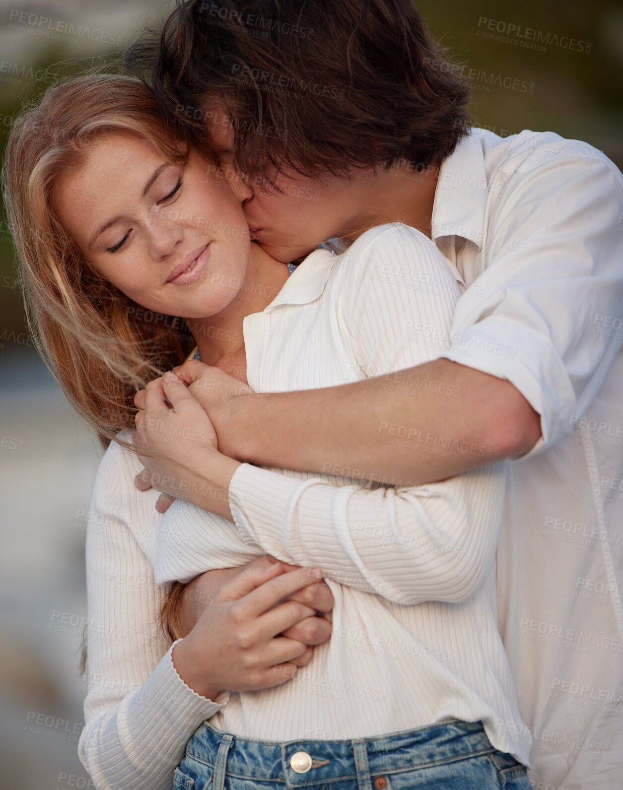 Buy stock photo Love, kiss and couple hug, quality time and celebration with smile, relationship and affection. Romance, man or woman embrace, bonding or loving with joy, anniversary or romantic outdoor and cheerful