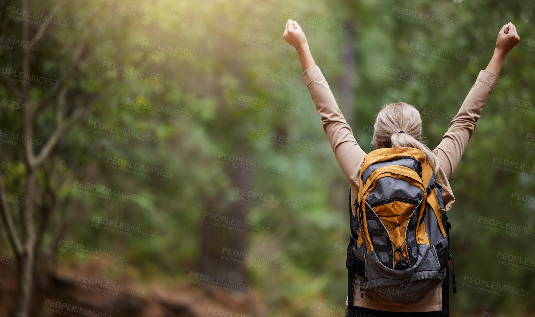 Buy stock photo Back of woman, hiking and arms of freedom, success and hope of courage, achievement and mockup. Hiker celebrate travel, motivation and inspiration of goals, wellness and energy of adventure in forest