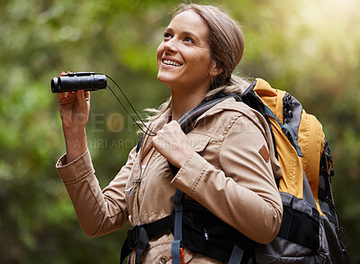 Buy stock photo Nature, hiking and woman with binoculars, adventure trail on holiday in African game reserve. Trekking, trees and forest hike, sightseeing and person with smile on happy mountain walk in South Africa