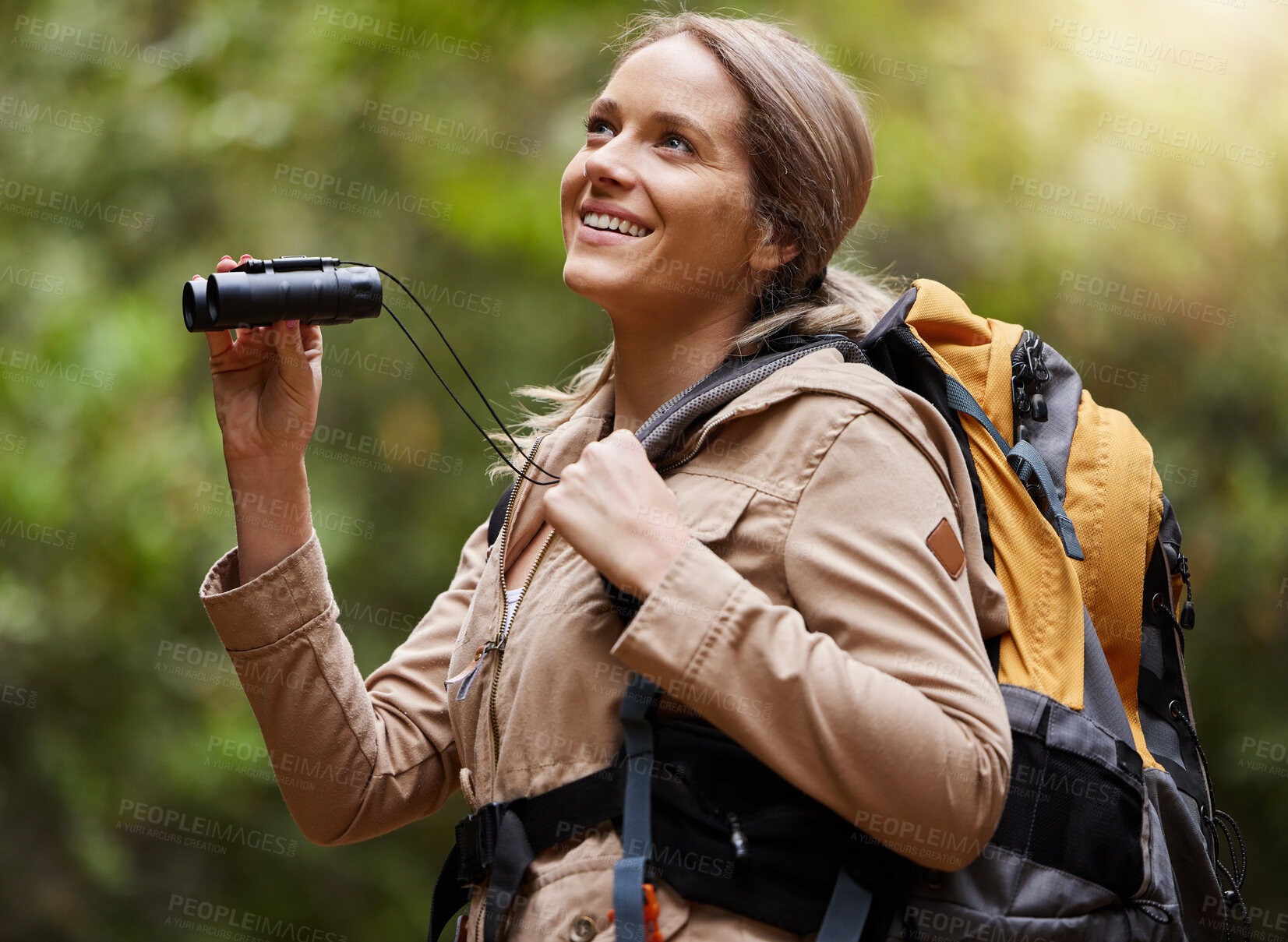 Buy stock photo Nature, hiking and woman with binoculars, adventure trail on holiday in African game reserve. Trekking, trees and forest hike, sightseeing and person with smile on happy mountain walk in South Africa