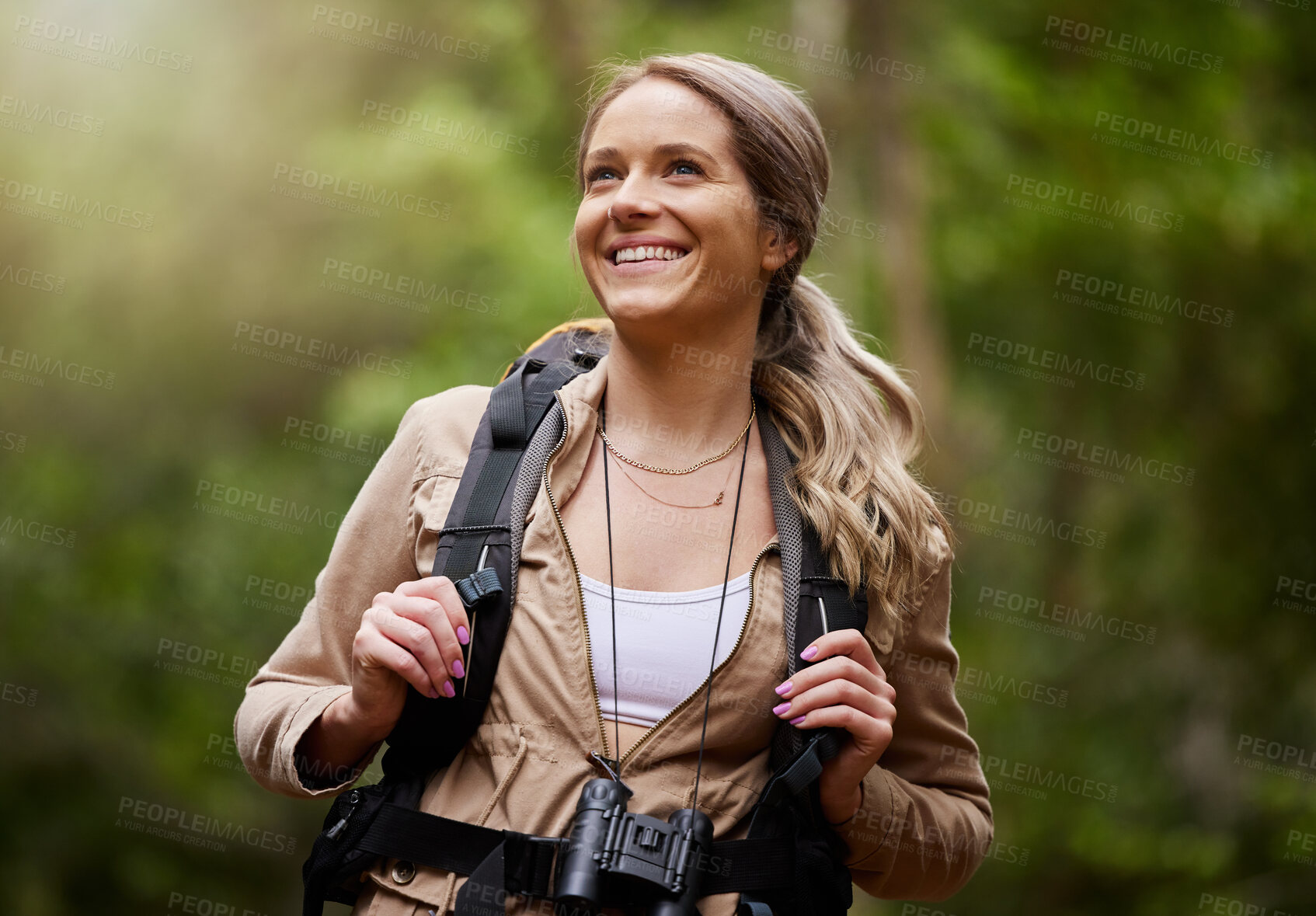 Buy stock photo Hiking, smile and woods with a woman outdoor, walking in nature or the wilderness for adventure. Freedom, location and forest with an attractive young female hiker taking a walk in a natural park