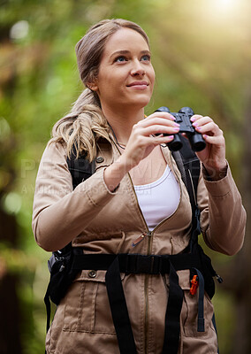 Buy stock photo Binoculars, nature and happy woman hiking for travel journey, jungle adventure and forest explore with backpack gear. Sports hiker or person birdwatching and trekking in eco, green or tropical woods