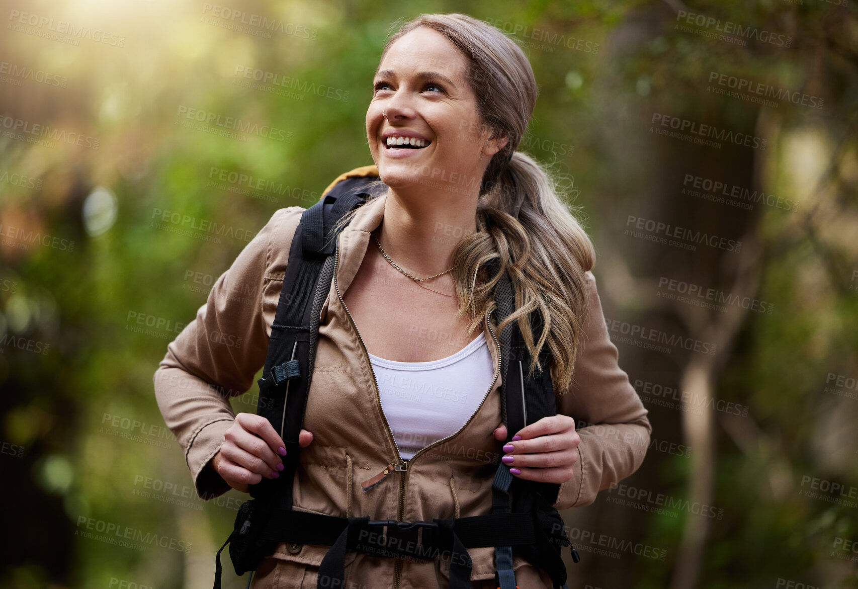 Buy stock photo Hiking, happy and woods with a woman outdoor, walking in nature or the wilderness for adventure. Freedom, location and forest with an attractive young female hiker taking a walk in a natural park