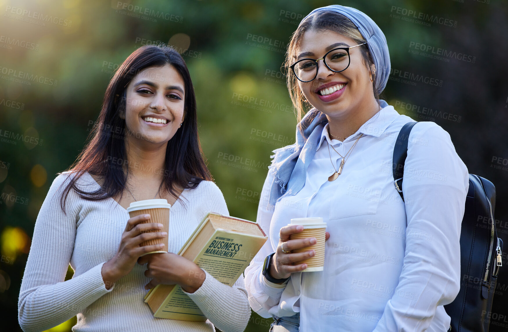 Buy stock photo Happy, portrait or university friends in park on campus for learning, education or future goals together. Smile, Muslim or students relaxing with school books meeting to research or college knowledge