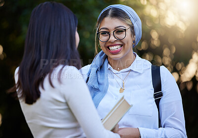 Buy stock photo Happy, talking or university friends at park on campus for learning, education or future goals together. Women, Muslim or students relaxing with school books meeting for research or college knowledge