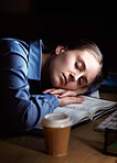 Tired woman sleeping on her desk at night with depression, burnout and mental health risk for project deadline or overworked. Business person, worker or employee sleep, fatigue and low energy in dark