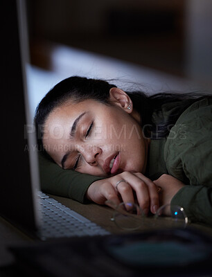 Buy stock photo Exhausted, night and a business woman sleeping at her desk while working overtime in her office. Burnout, deadline and tired with a female employee asleep in the workplace during the late shift