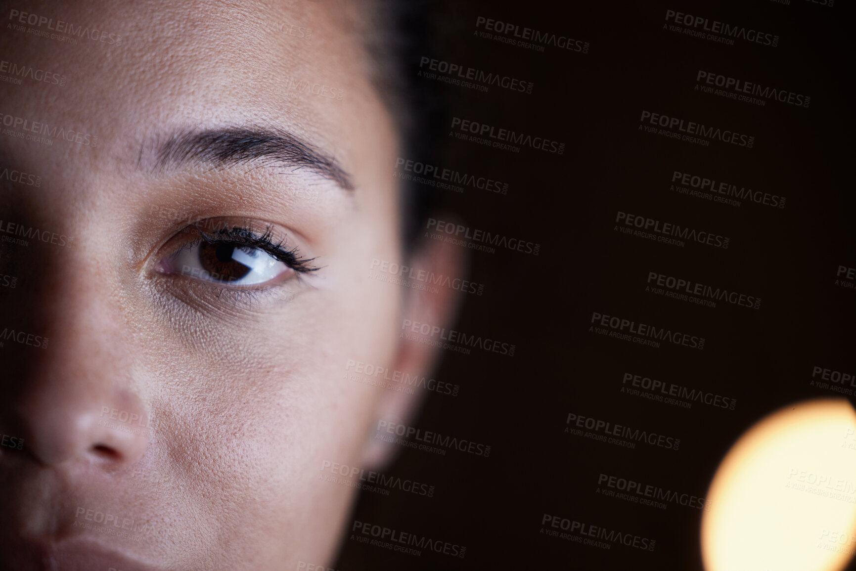 Buy stock photo Looking, dark and portrait of a woman in the office for a deadline, overtime and working late. Mockup, serious and half face of an employee in the workplace at night for work and corporate dedication