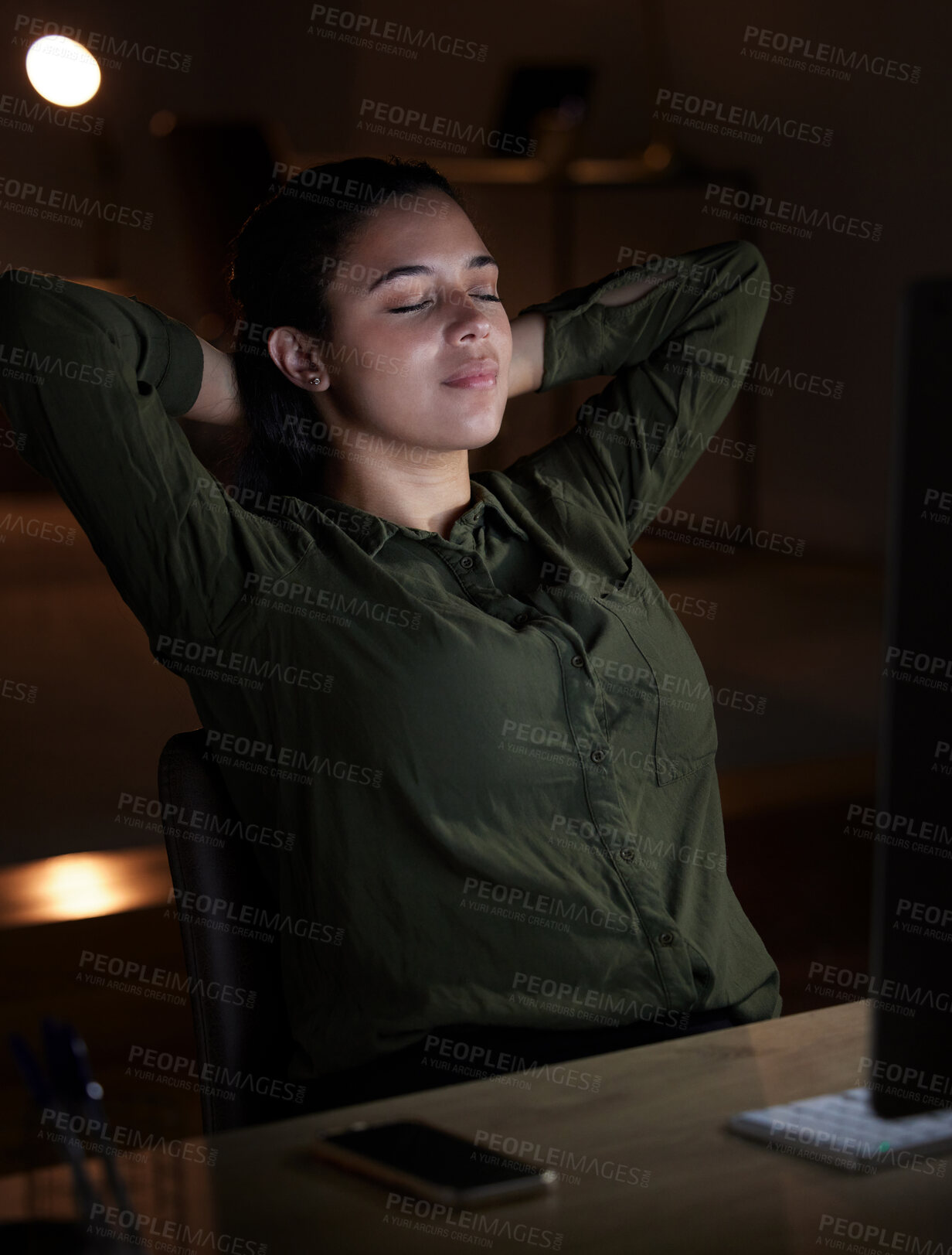 Buy stock photo Night, relax and overtime with a business woman in her office, sitting hands behind head after a late shift. Peace, quiet and calm with a young female resting in the workplace after a deadline