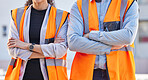 Building, collaboration and proud team at construction site for partnership, design and creative innovation. Crossed arms, engineer and man with woman leading industrial planning, vision and mission