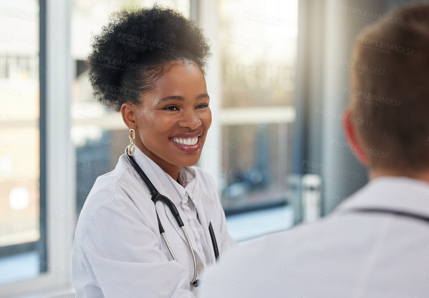 Buy stock photo Doctor, happy black woman and meeting healthcare team for hospital management, medicine and discussion. Female surgeon, smile and talking to employees in collaboration, surgery and medical planning